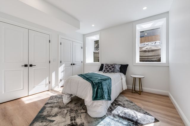 a bed room with a bed and a window