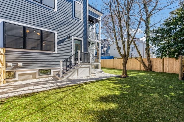 a house view with a backyard space