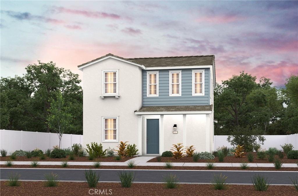 a front view of a house with trees