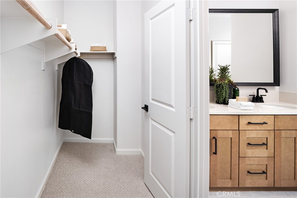 4083 Summer Way Corona, CA 92883 - Photo 13 of 18 a bathroom with a sink and a mirror