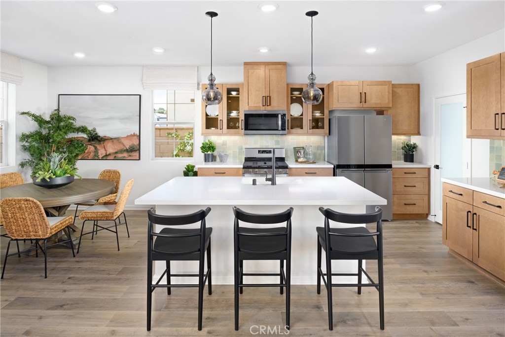 4083 Summer Way Corona, CA 92883 - Photo 4 of 18 a view of a dining room with furniture