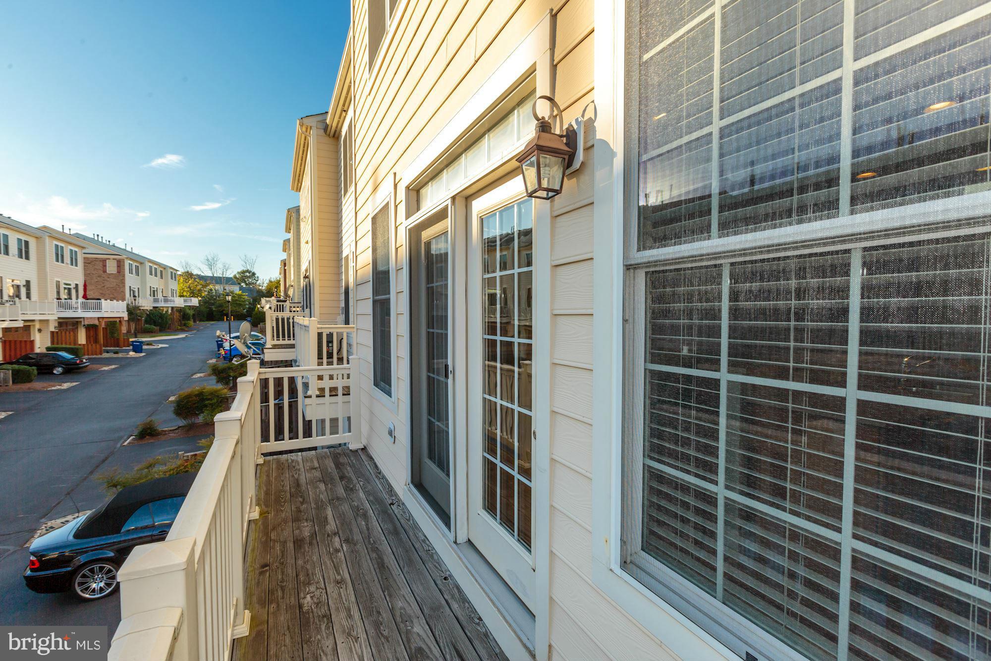 397 Spring Street Herndon, VA 20170 - Photo 13 of 30 a view of a balcony with a glass door
