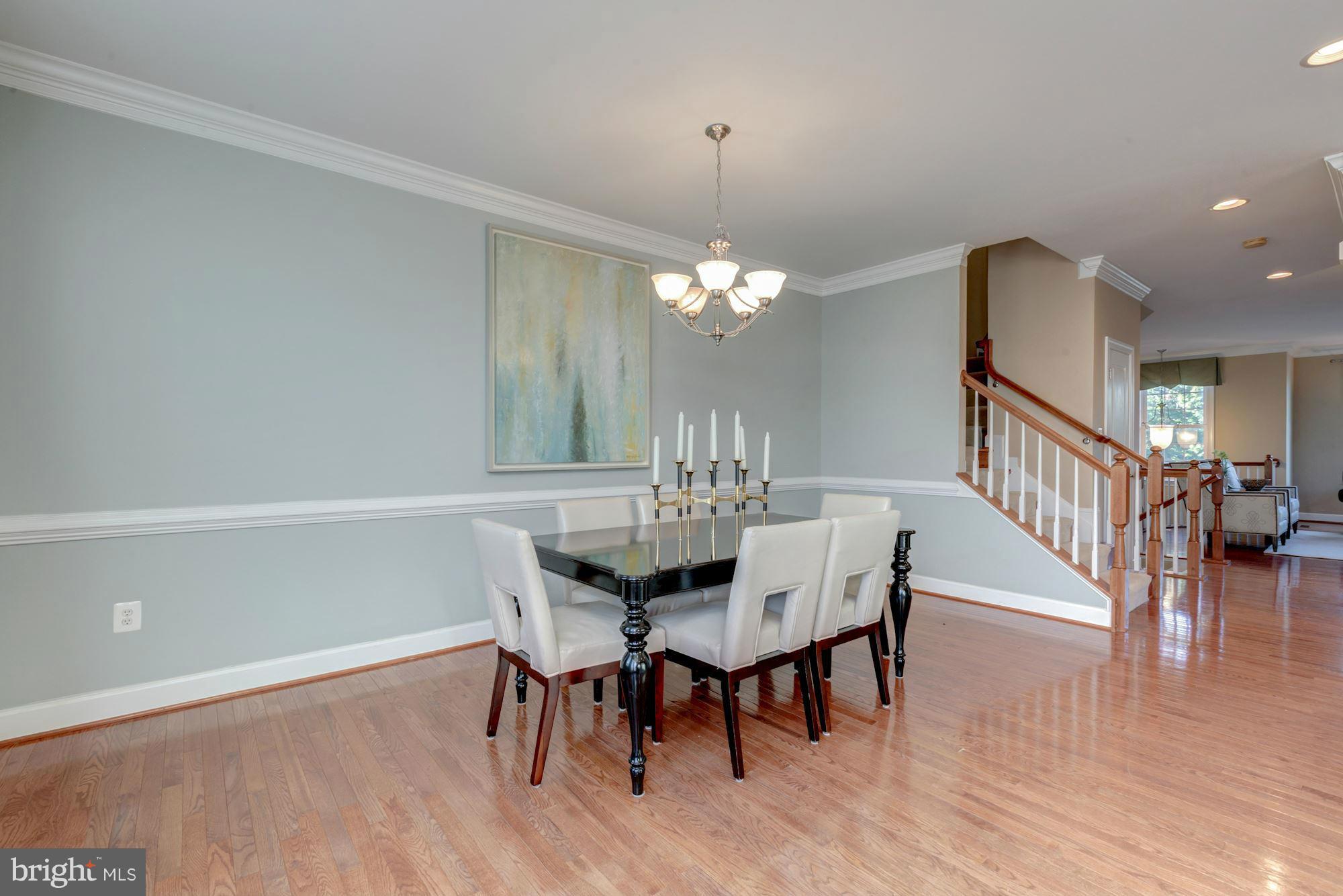 397 Spring Street Herndon, VA 20170 - Photo 14 of 30 a view of a dining room with furniture and wooden floor
