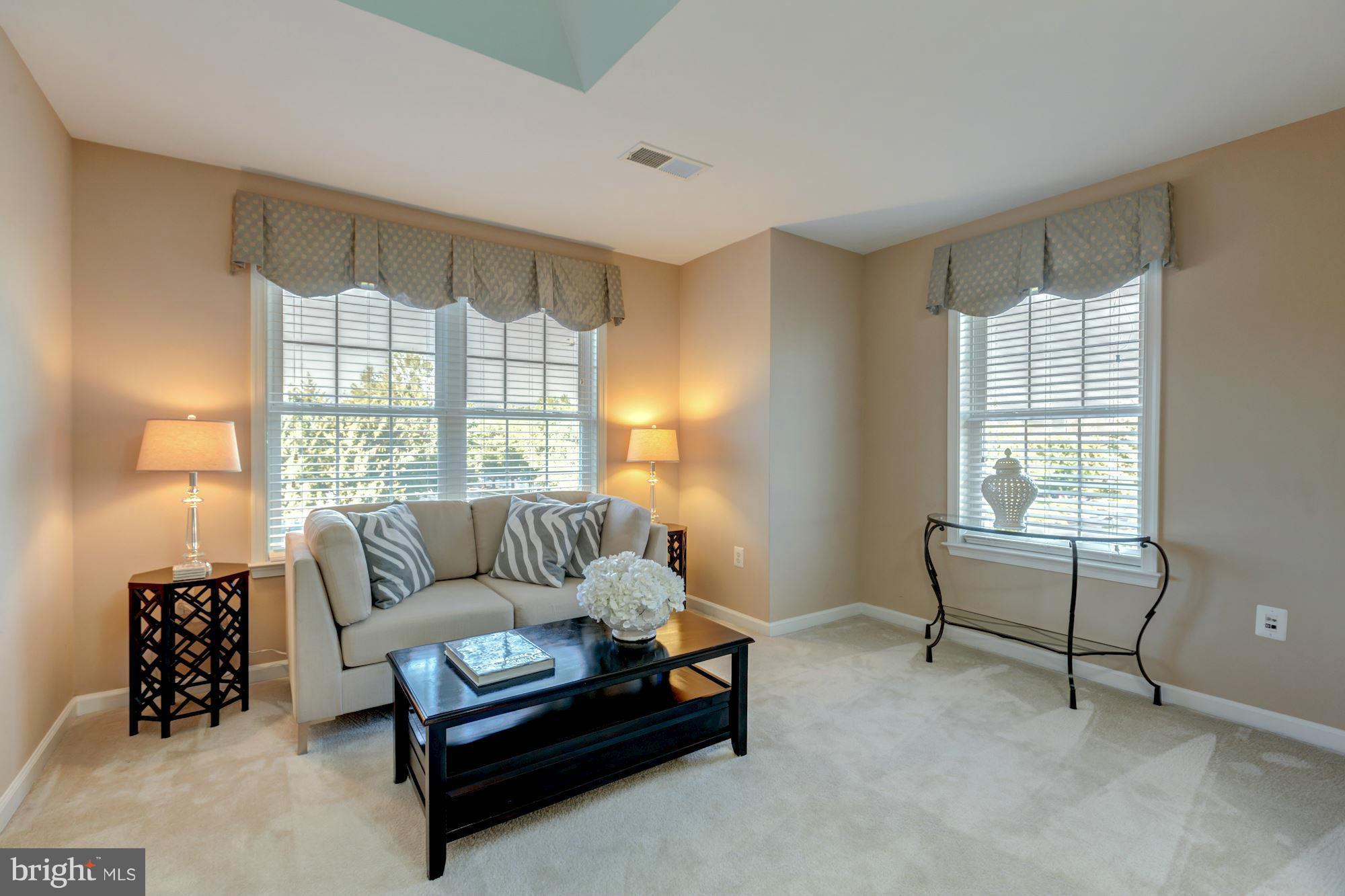 397 Spring Street Herndon, VA 20170 - Photo 16 of 30 a living room with furniture and a window