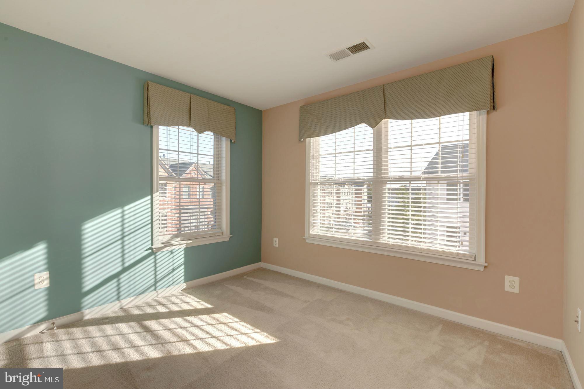 397 Spring Street Herndon, VA 20170 - Photo 22 of 30 a view of an empty room with a window