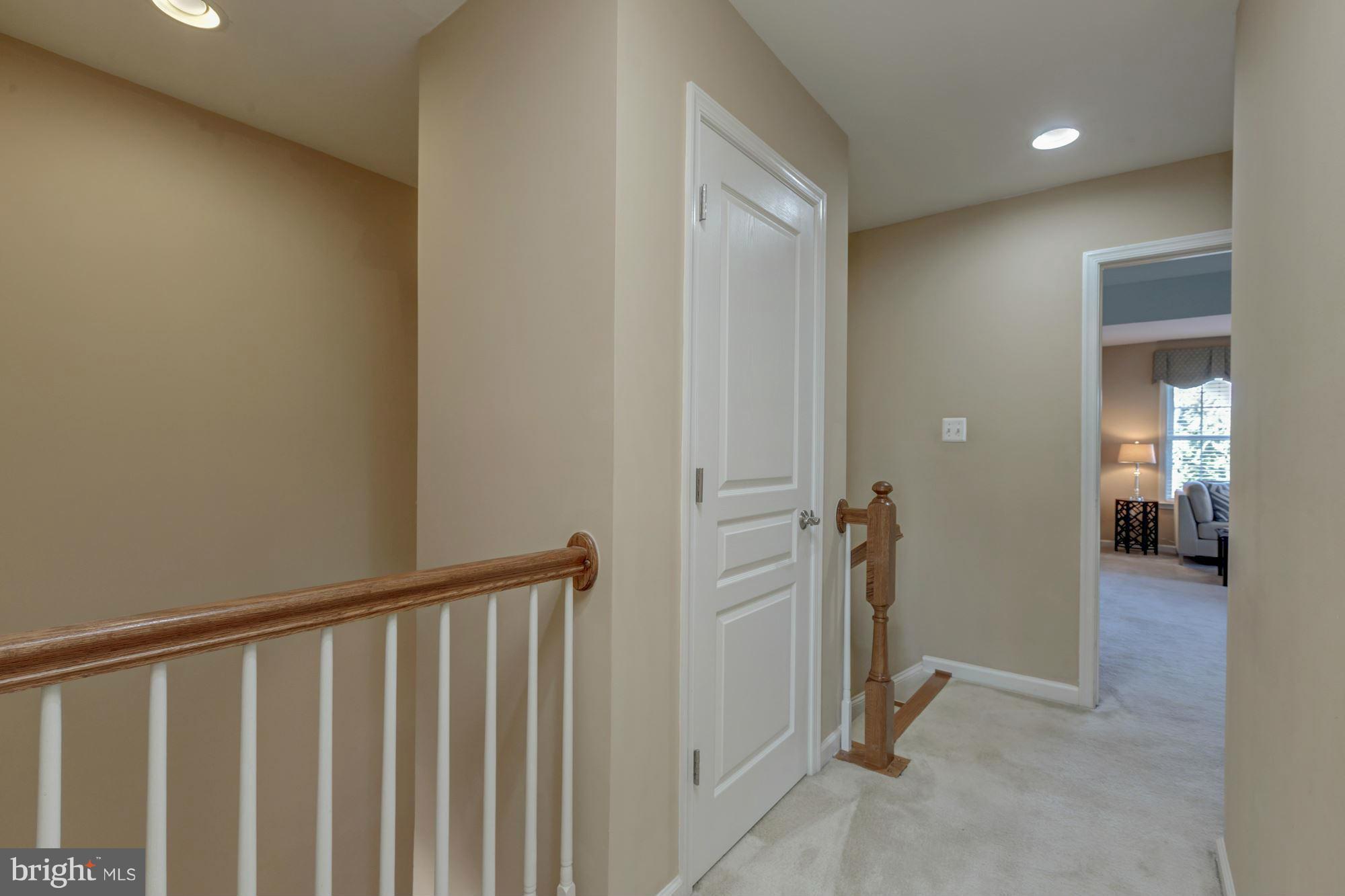 397 Spring Street Herndon, VA 20170 - Photo 23 of 30 a view of a hallway with wooden floor