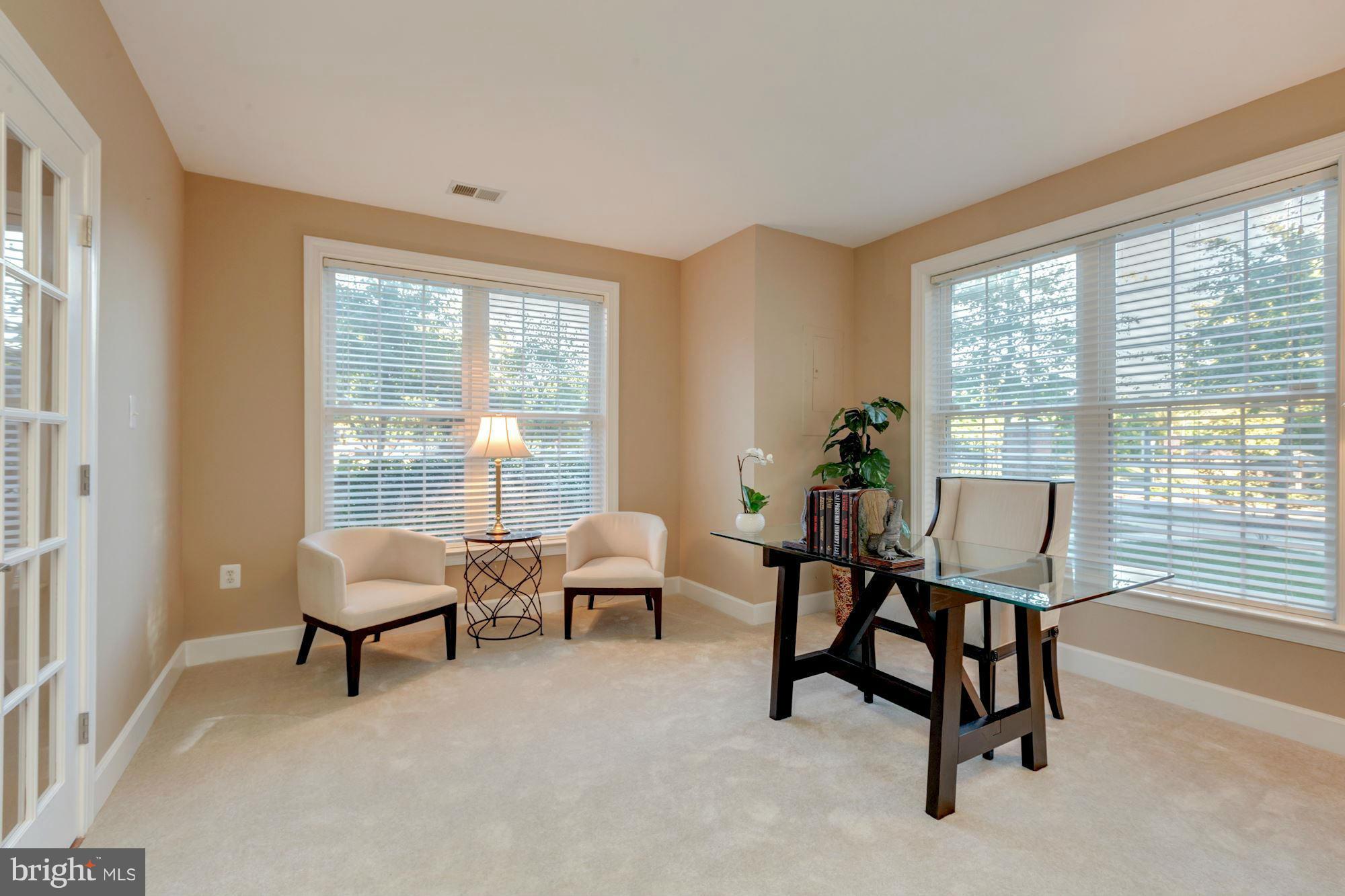 397 Spring Street Herndon, VA 20170 - Photo 4 of 30 a living room with furniture and a window