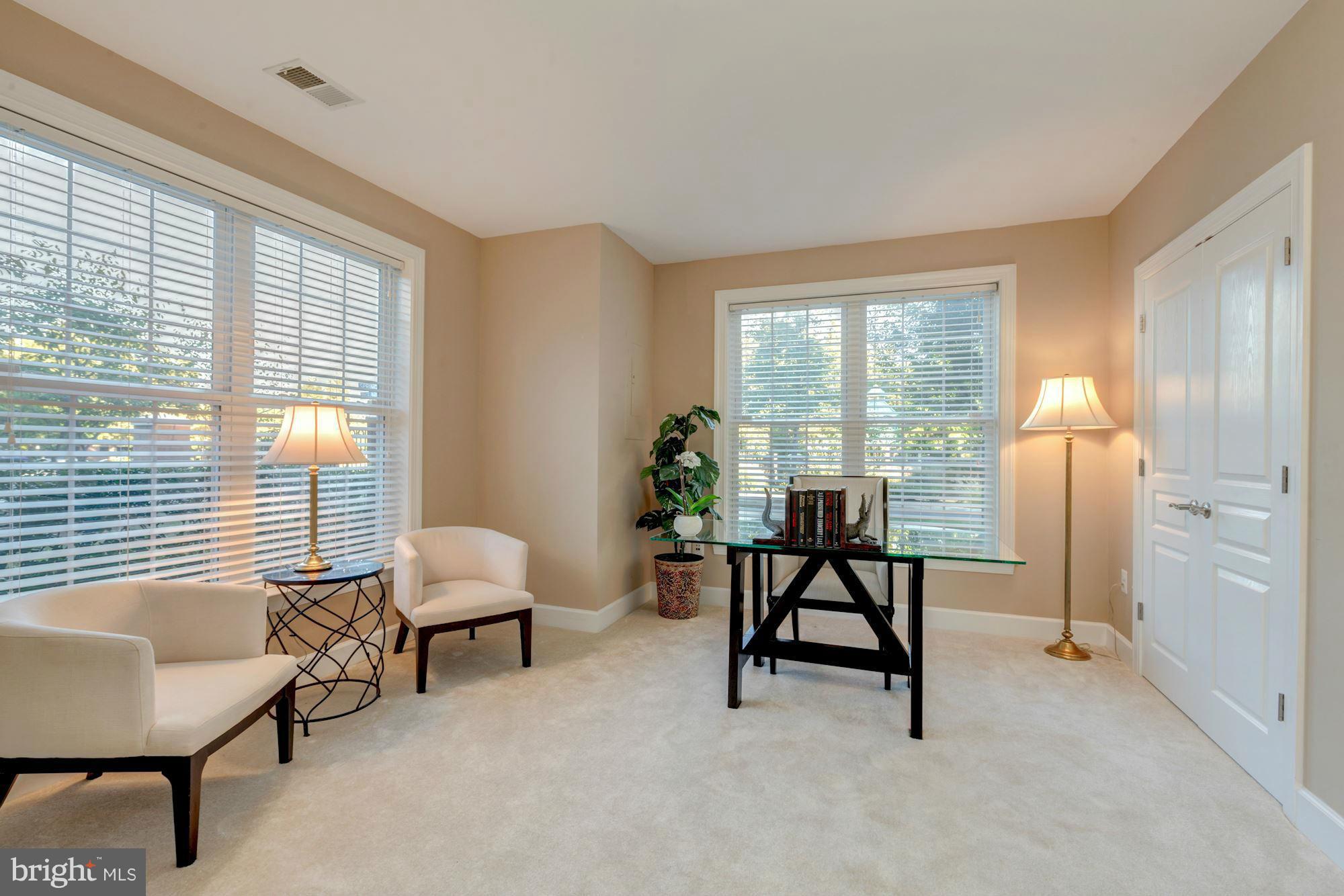 397 Spring Street Herndon, VA 20170 - Photo 5 of 30 a living room with furniture and a window