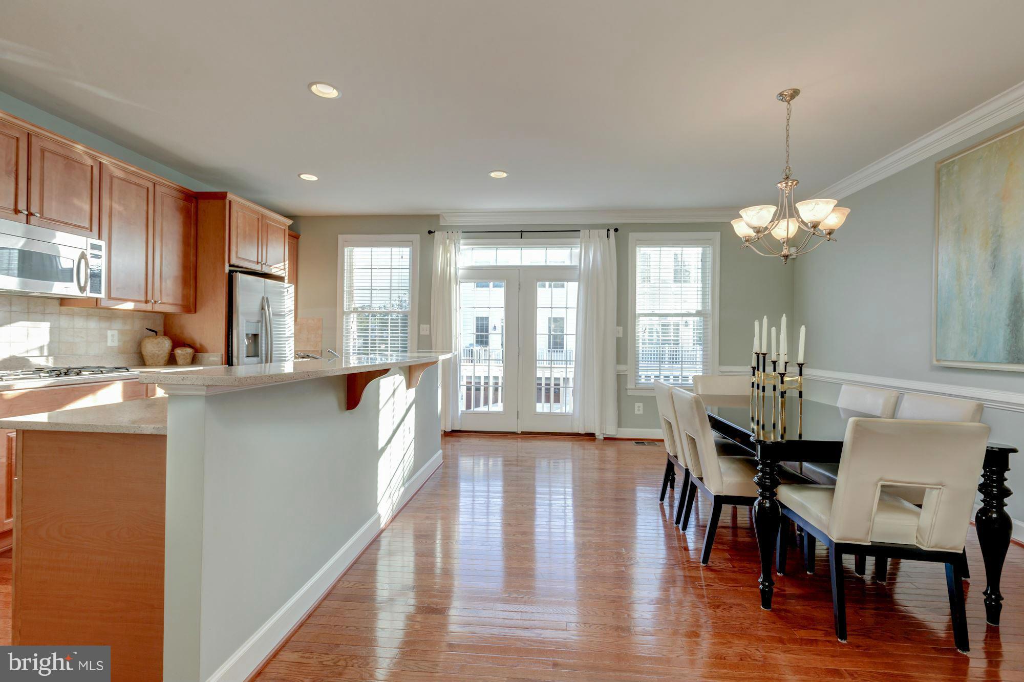 397 Spring Street Herndon, VA 20170 - Photo 8 of 30 a living room with furniture and a wooden floor