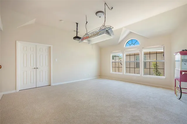 a kitchen with granite countertop a stove and a refrigerator