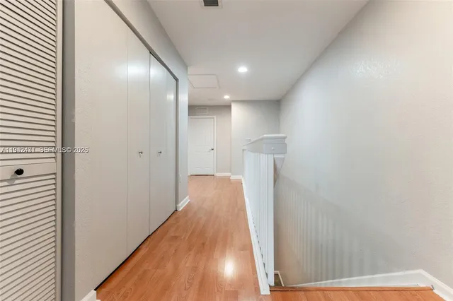 a view of walk in closet with clothes