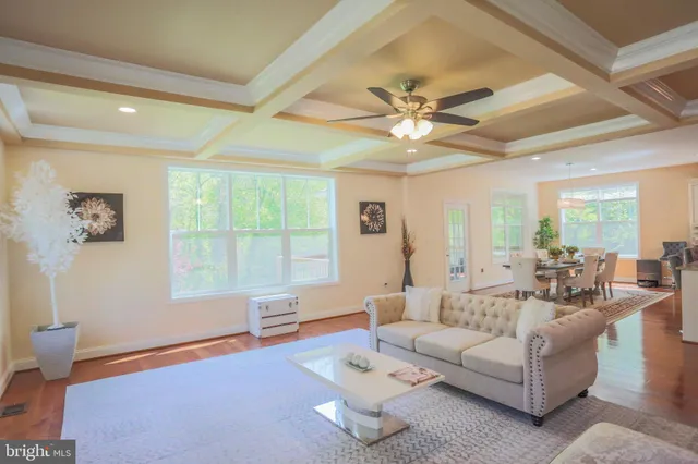 a view of living room with furniture and natural light