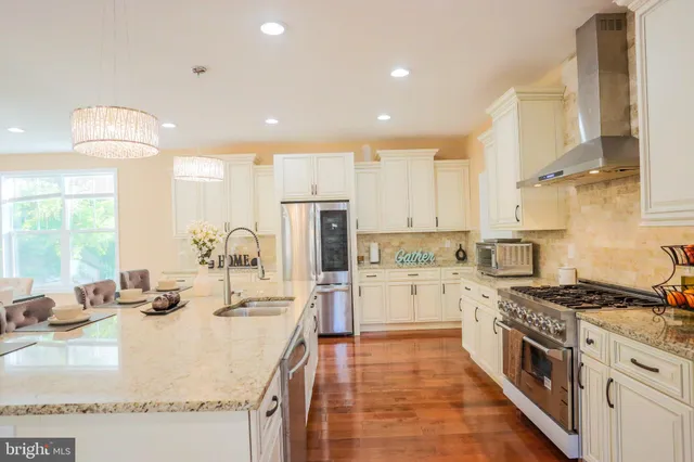 a view of a livingroom with furniture and a window