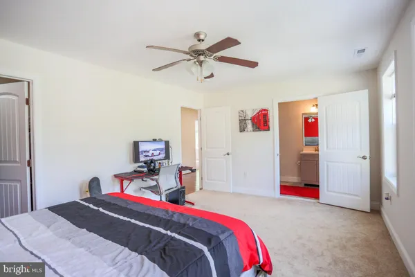 a view of a room with wooden floor and furniture