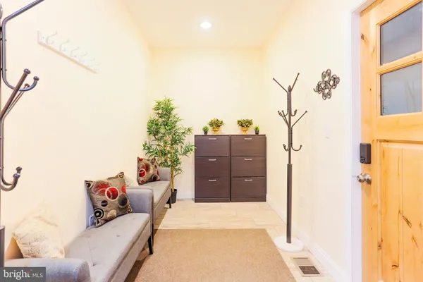 a view of entryway with wooden floor