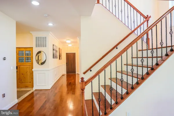 a view of kitchen and dining room with wooden floor