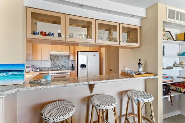 a kitchen with a dining table and chairs