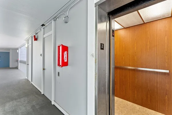 a bathroom with a shower and a door