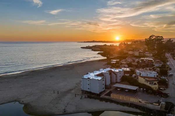 an aerial view of beach and ocean