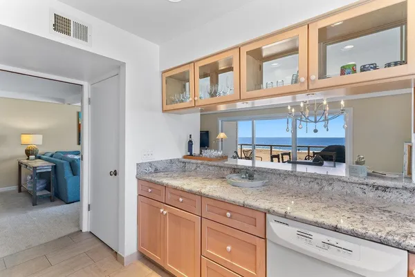 a kitchen with cabinets and a window