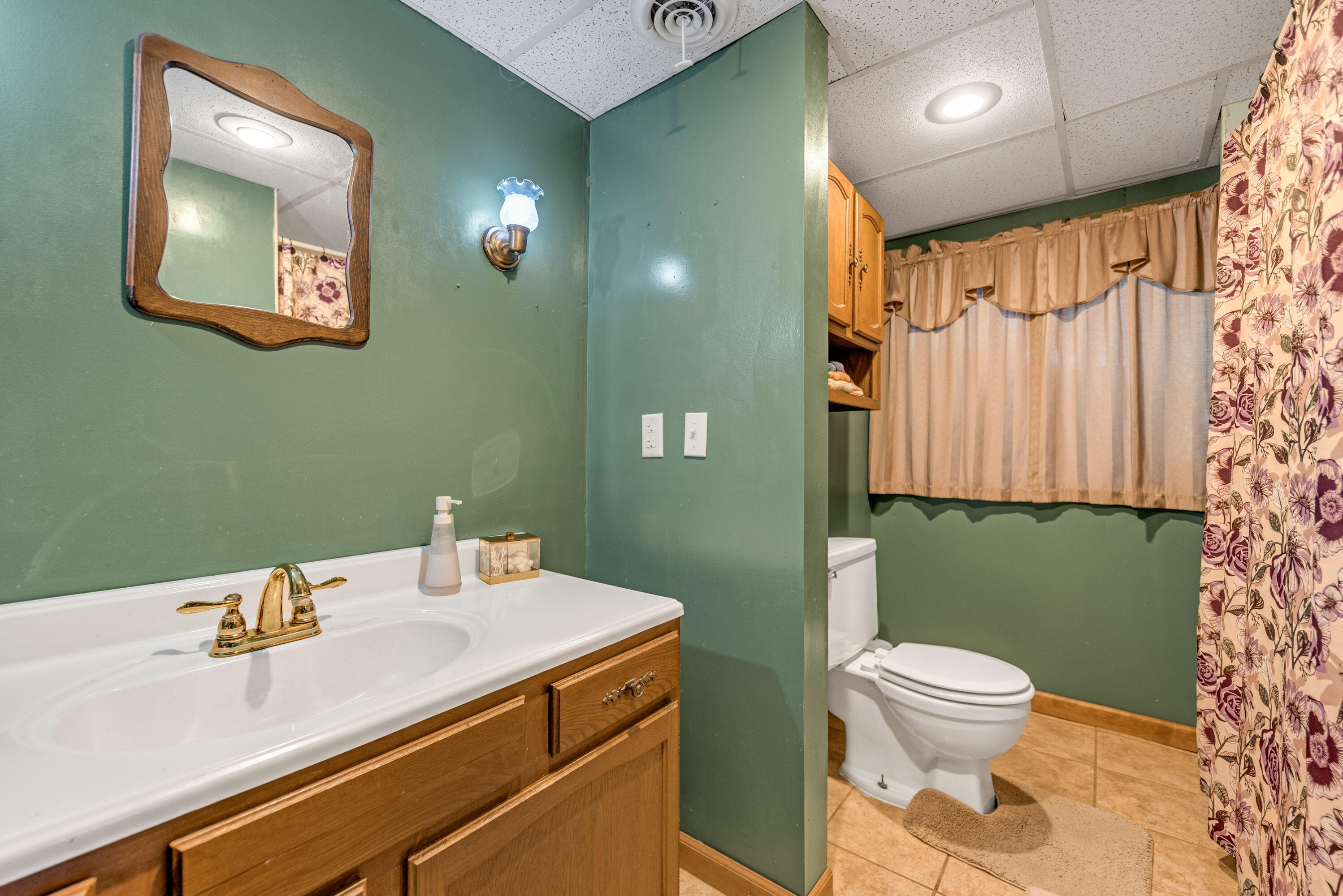 2337 Four Seasons Parkway Crown Point, IN 46307 - Photo 12 of 18 a bathroom with a sink a toilet and a mirror