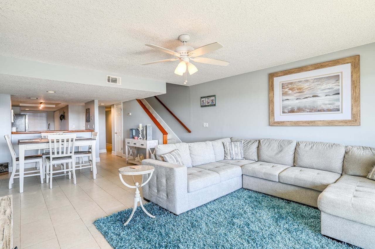 120 Sunset Harbor Way, Unit 204 St. Augustine, FL 32080 - Photo 20 of 49 a living room with furniture and a view of kitchen