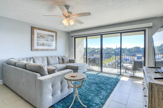 a balcony with table and chairs
