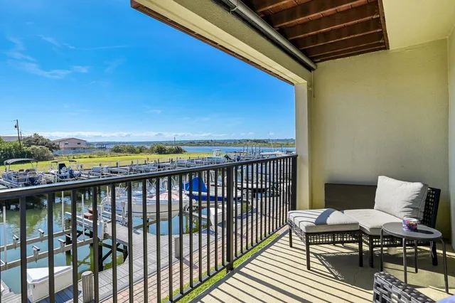 a view of a balcony with furniture