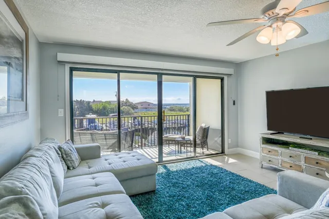 a view of living room with furniture and entryway