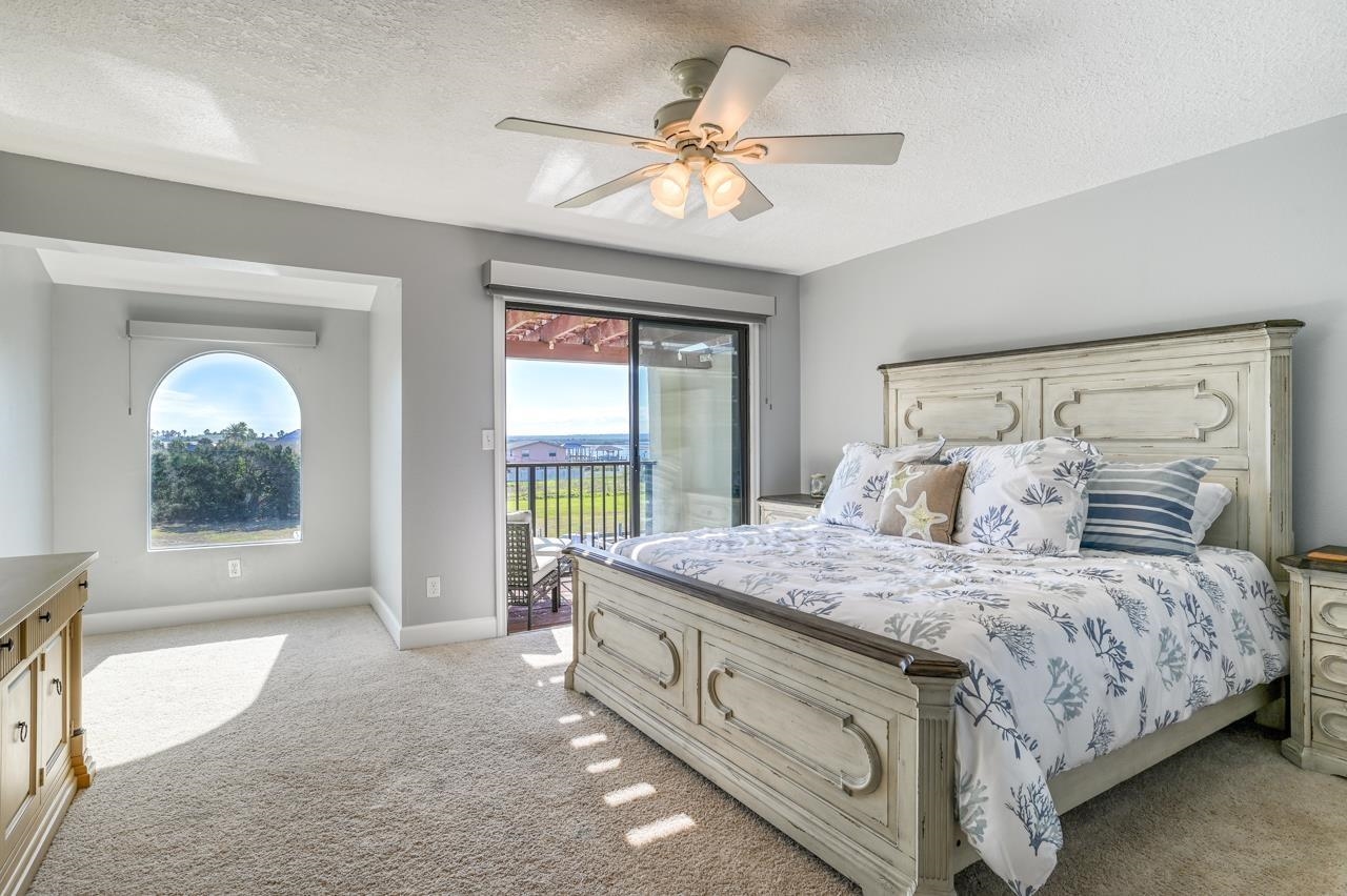 120 Sunset Harbor Way, Unit 204 St. Augustine, FL 32080 - Photo 29 of 49 a bedroom with a large bed and a window