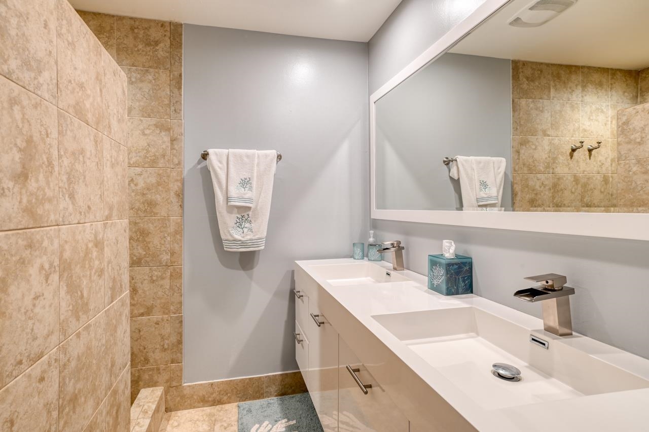 120 Sunset Harbor Way, Unit 204 St. Augustine, FL 32080 - Photo 35 of 49 a bathroom with a sink and a mirror