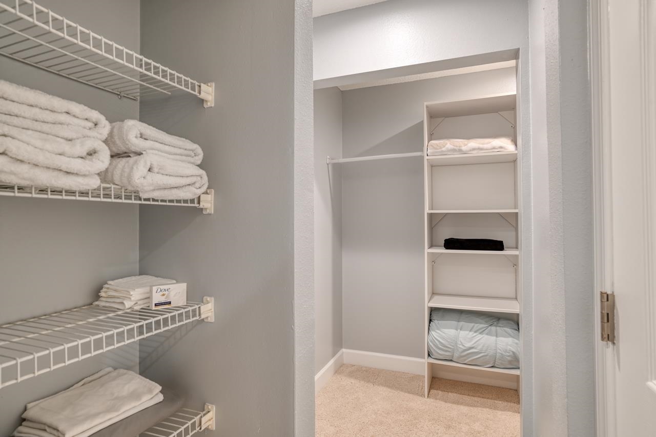 120 Sunset Harbor Way, Unit 204 St. Augustine, FL 32080 - Photo 37 of 49 a room with a wooden floor and shelf