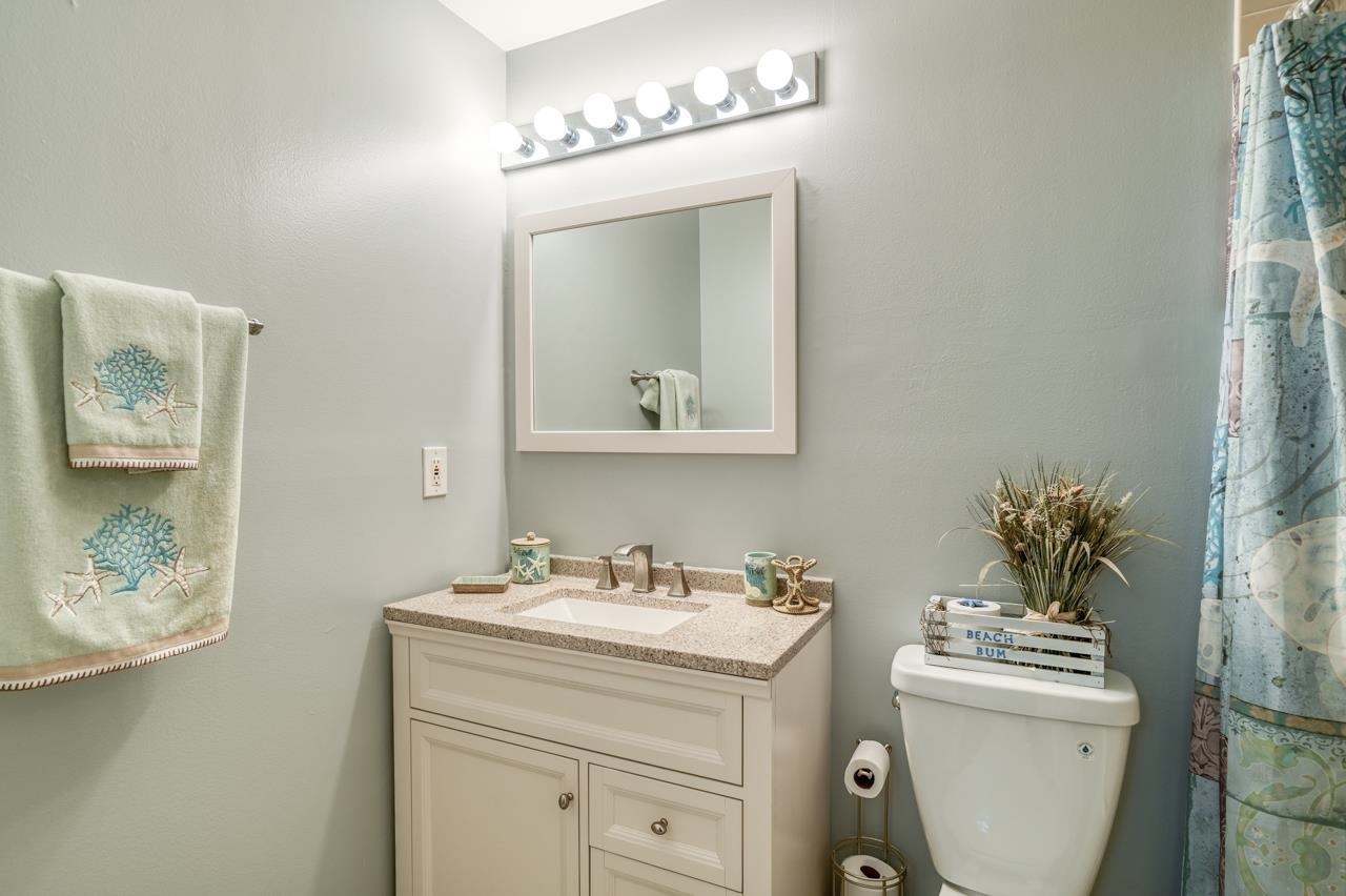 120 Sunset Harbor Way, Unit 204 St. Augustine, FL 32080 - Photo 41 of 49 a bathroom with a sink mirror and vanity