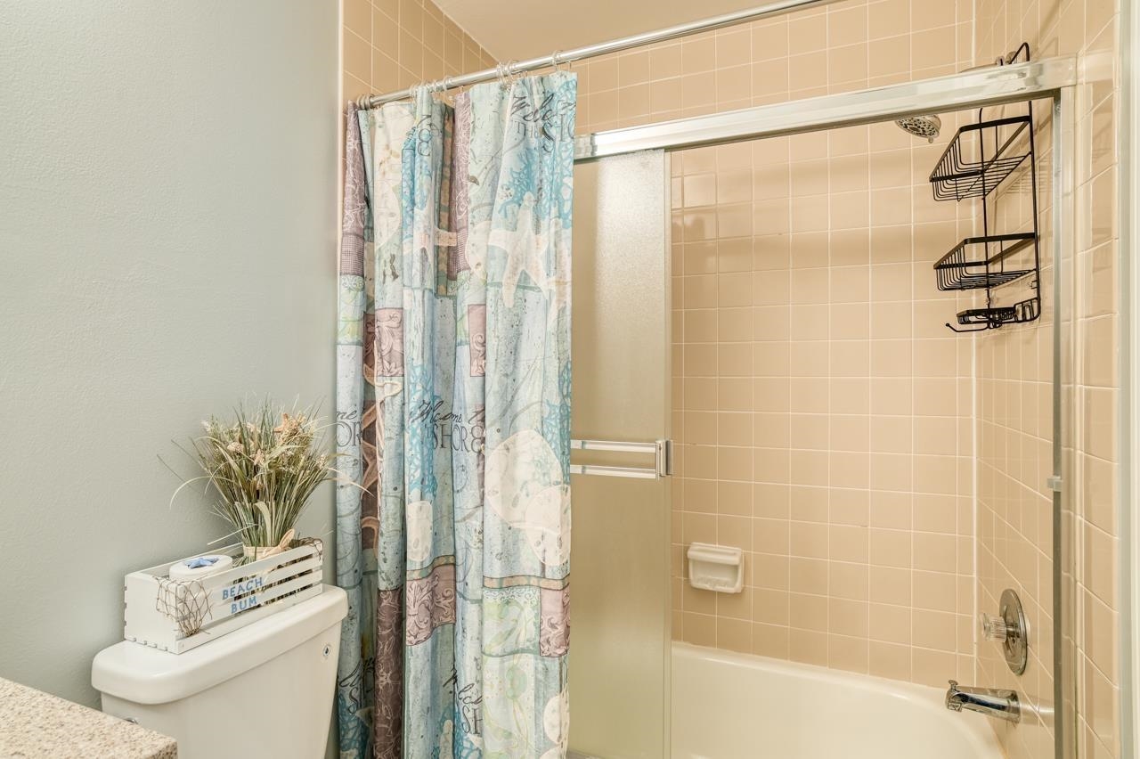 120 Sunset Harbor Way, Unit 204 St. Augustine, FL 32080 - Photo 42 of 49 a bathroom with a shower and a toilet
