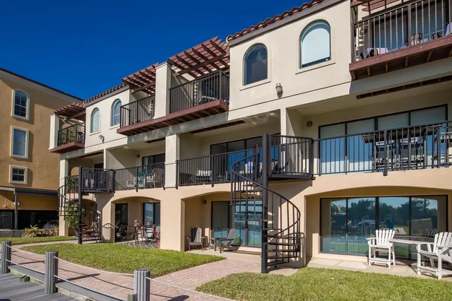 a front view of a building and a garden