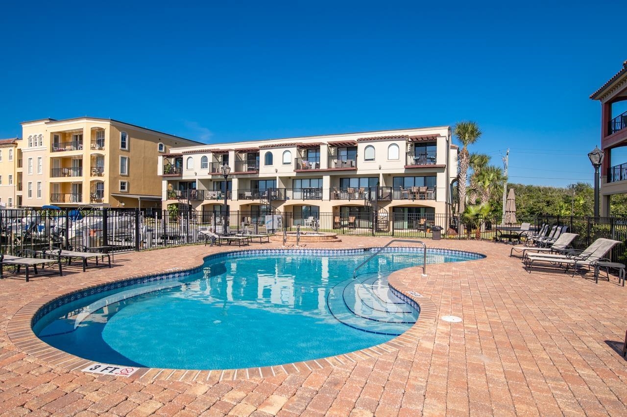 120 Sunset Harbor Way, Unit 204 St. Augustine, FL 32080 - Photo 8 of 49 a view of a swimming pool with outdoor seating