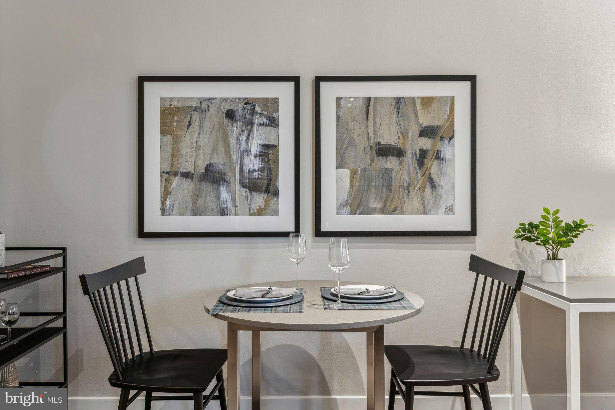 875 Sansom Street, Unit 925 Philadelphia, PA 19107 - Photo 12 of 35 a view of a dining room with furniture wooden floor and a window