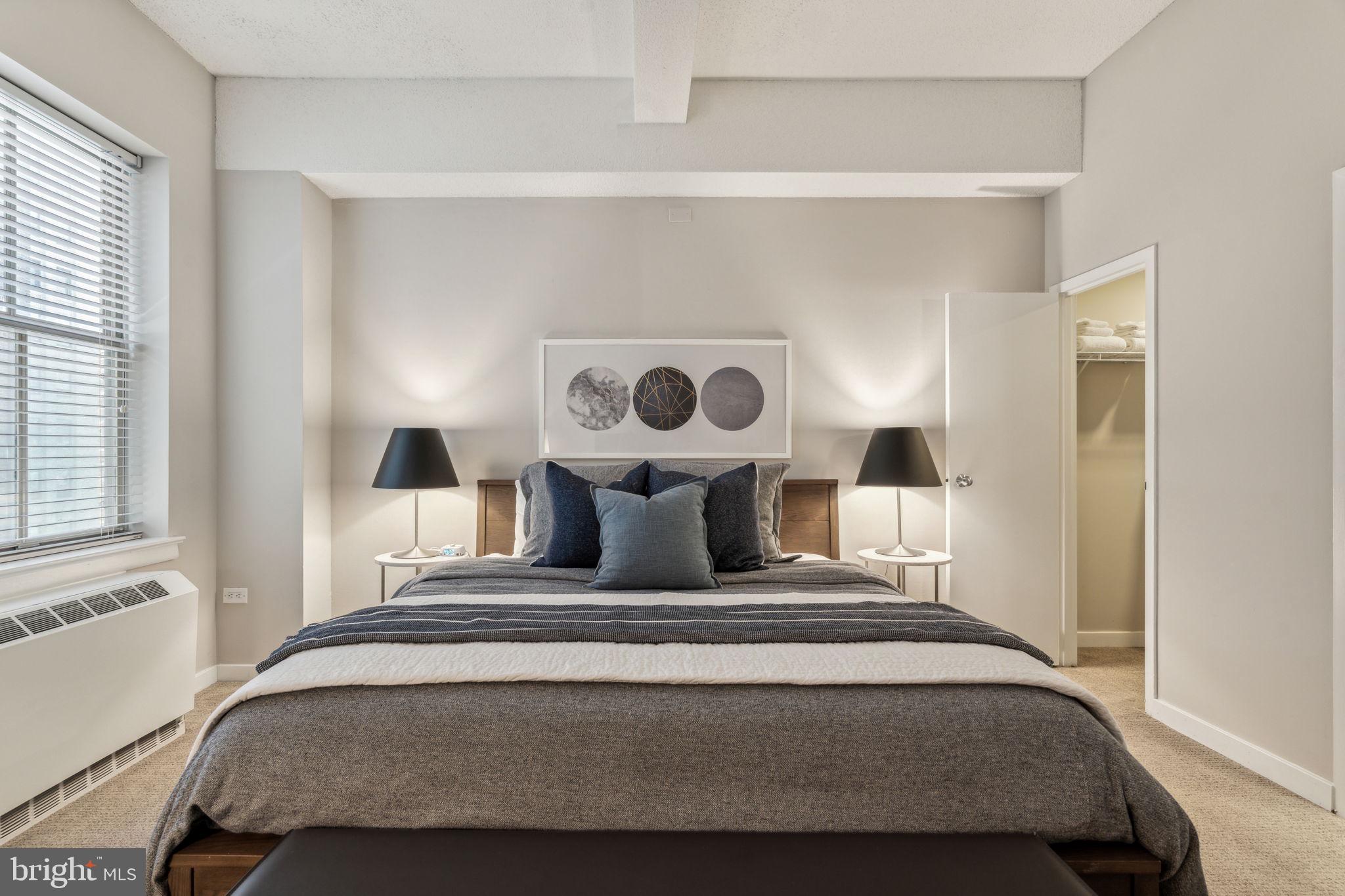 875 Sansom Street, Unit 925 Philadelphia, PA 19107 - Photo 14 of 35 a bedroom with a bed and window