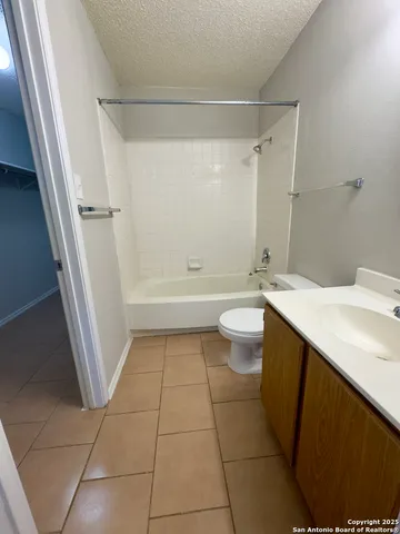 a bathroom with a sink a toilet and a shower