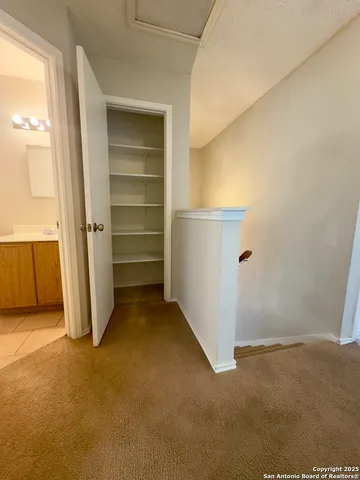 a view of room with an empty refrigerator