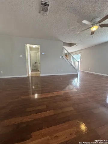 a view of a hallway with a room