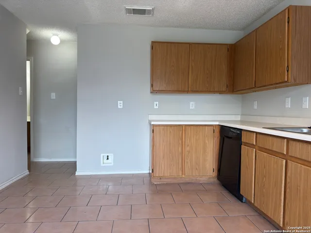 a view of a kitchen with cabinets
