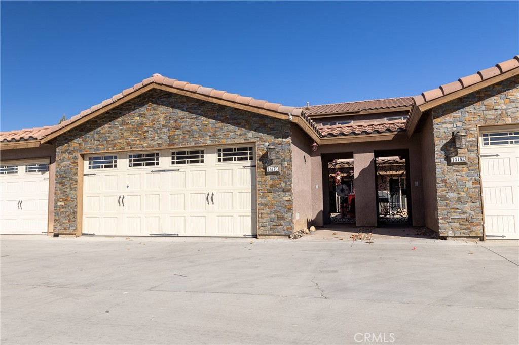 14176 Kiowa Road Apple Valley, CA 92307 - Photo 1 of 54 a front view of a house