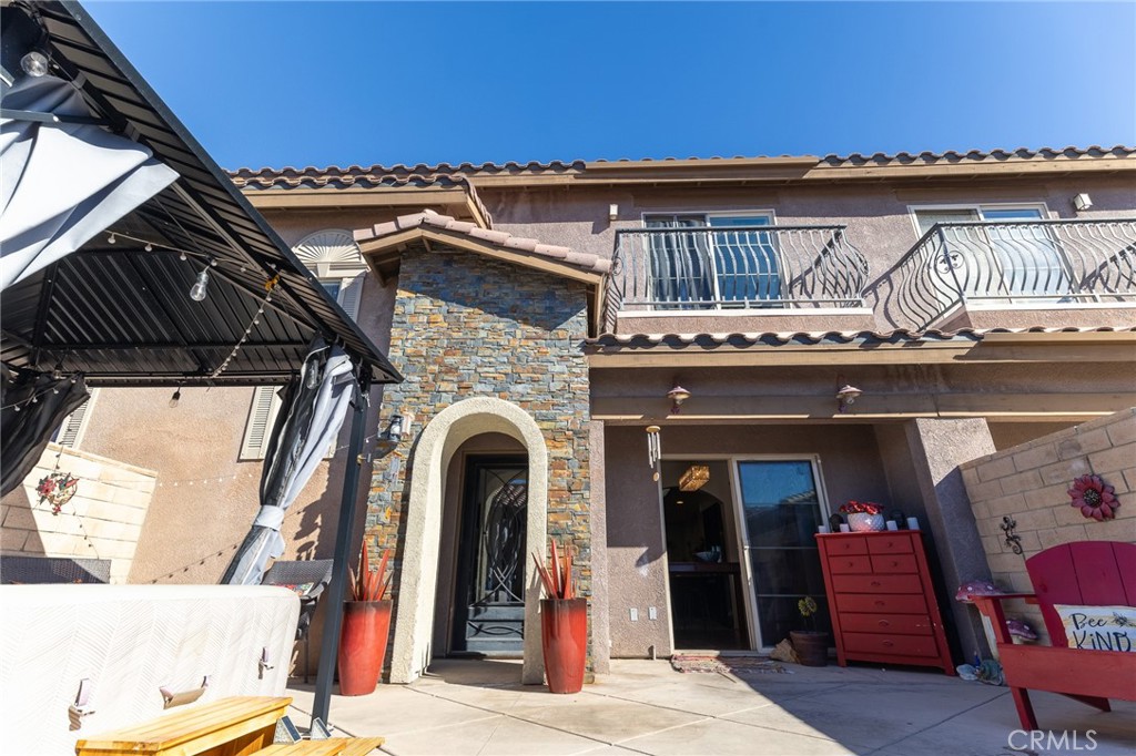 14176 Kiowa Road Apple Valley, CA 92307 - Photo 11 of 54 a view of a balcony with furniture and wooden floor