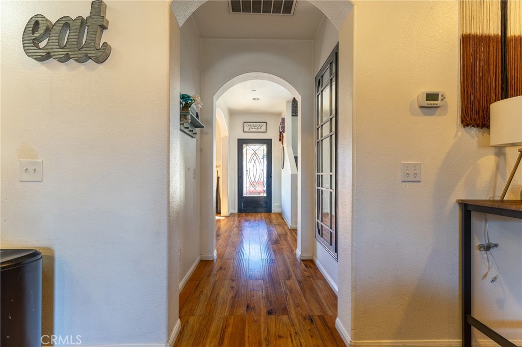 14176 Kiowa Road Apple Valley, CA 92307 - Photo 15 of 54 a view of a hallway with wooden floor