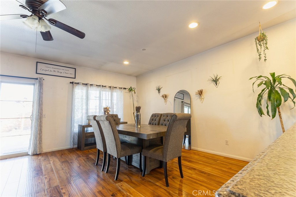 14176 Kiowa Road Apple Valley, CA 92307 - Photo 17 of 54 a view of a dining room with furniture and a window
