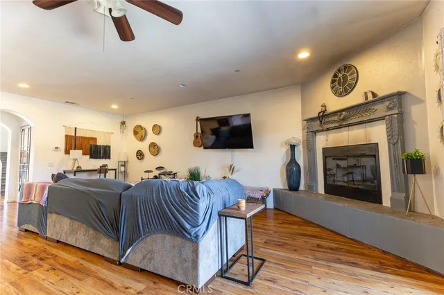 a kitchen with stainless steel appliances kitchen island granite countertop a refrigerator and cabinets