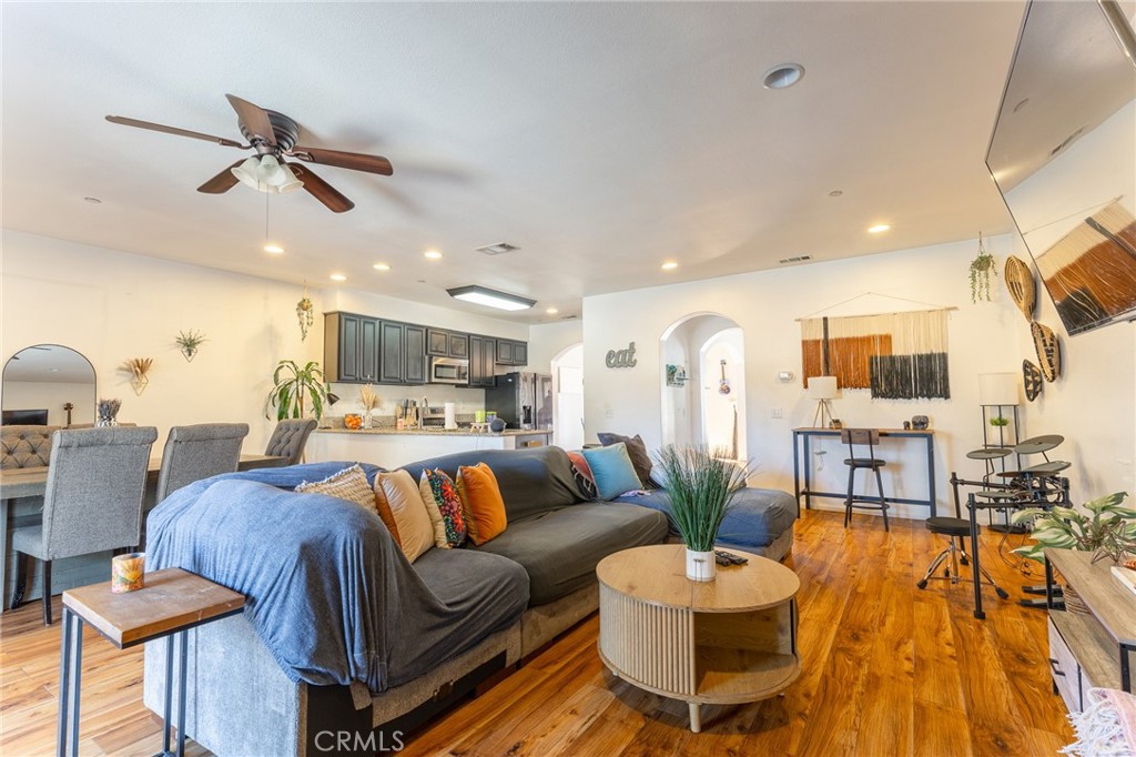 14176 Kiowa Road Apple Valley, CA 92307 - Photo 19 of 54 a living room with furniture and kitchen view
