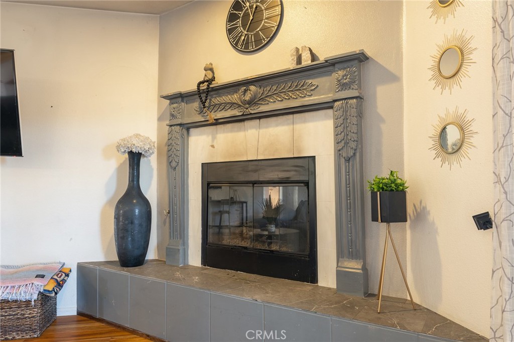 14176 Kiowa Road Apple Valley, CA 92307 - Photo 20 of 54 a living room with furniture and a fireplace
