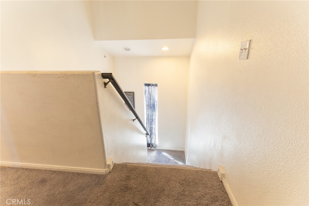 14176 Kiowa Road Apple Valley, CA 92307 - Photo 28 of 54 a view of a hallway with staircase